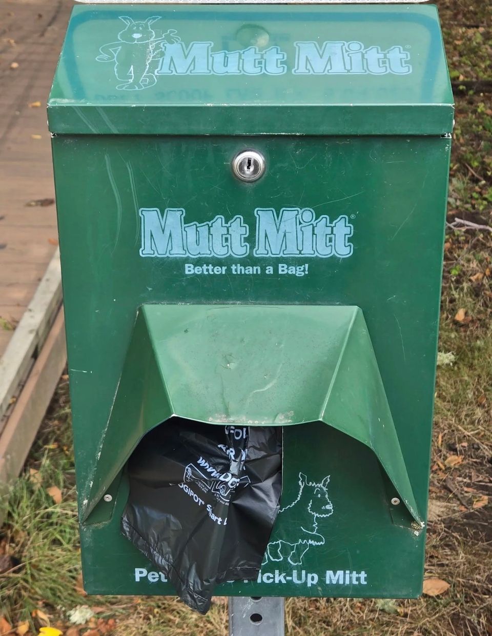 Green Mutt Mitt pet waste bag dispenser station